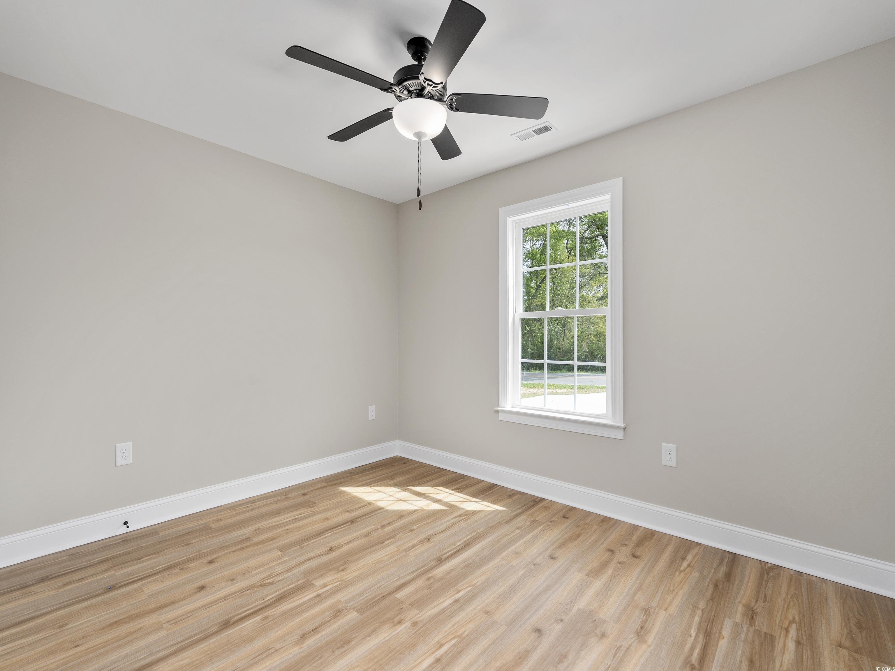 849 Highway 67 Loris Sc 29569 Loris, SC 29569 - Photo 18 of 28 Empty room featuring light wood-style floors, ceiling fan, baseboards, and visible vents