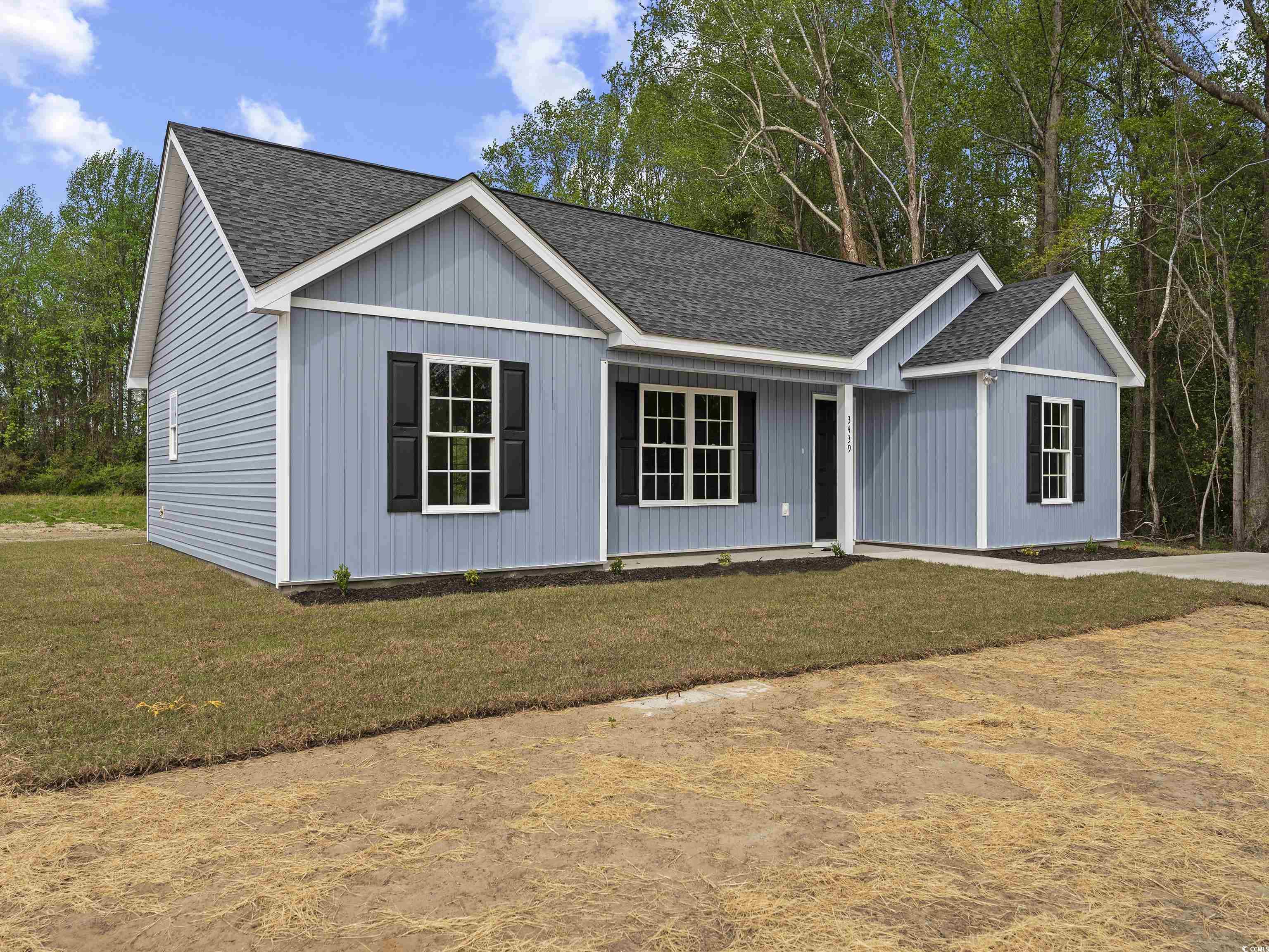 849 Highway 67 Loris Sc 29569 Loris, SC 29569 - Photo 2 of 28 Ranch-style house featuring a front lawn and roof with shingles