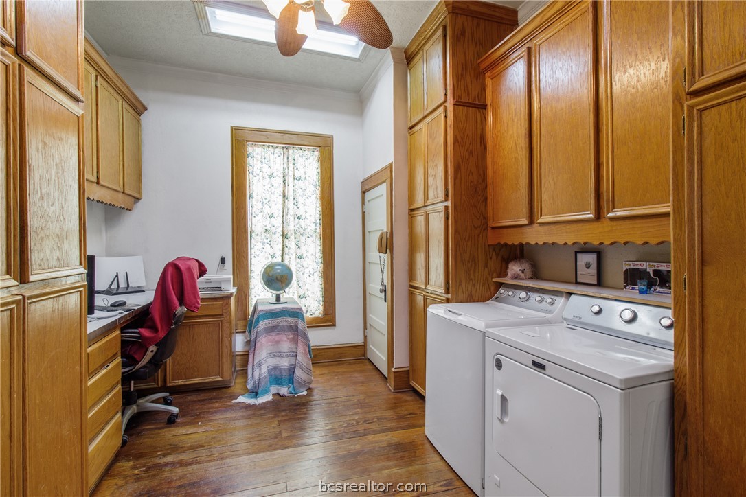 106 South Logan Avenue Bryan, TX 77803 - Photo 24 of 47 a view of a kitchen with fridge and workspace