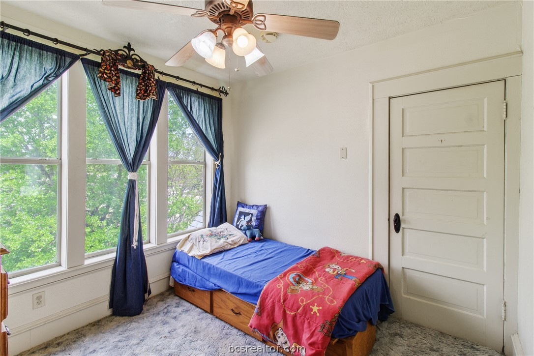 106 South Logan Avenue Bryan, TX 77803 - Photo 30 of 47 a bedroom with a bed and a large window