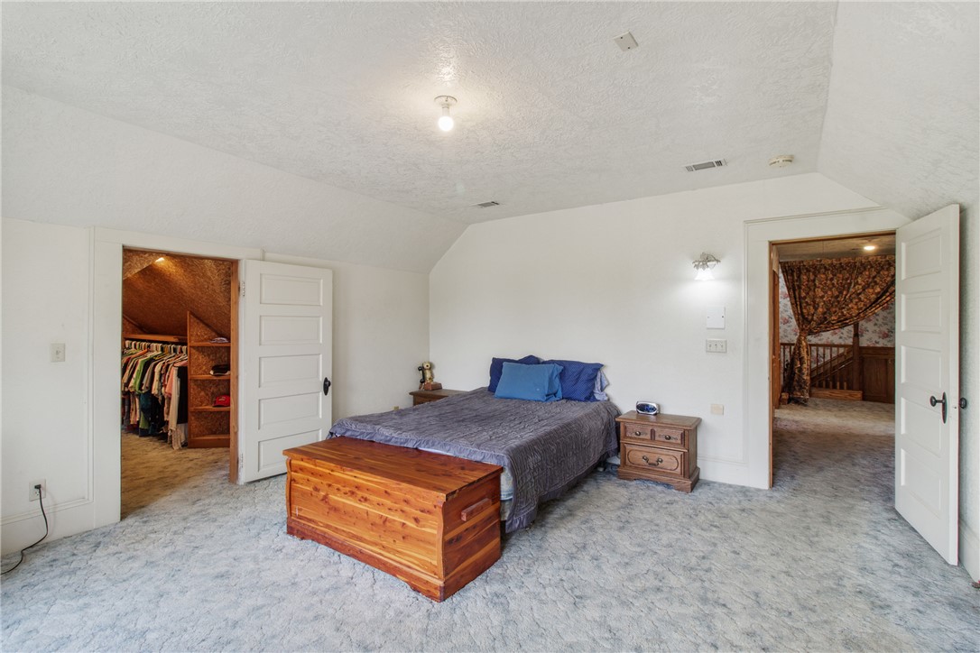 106 South Logan Avenue Bryan, TX 77803 - Photo 32 of 47 a spacious bedroom with a bed and a view of bathroom