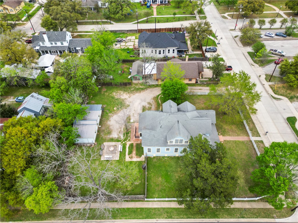 106 South Logan Avenue Bryan, TX 77803 - Photo 45 of 47 an aerial view of a house with a yard and lake view