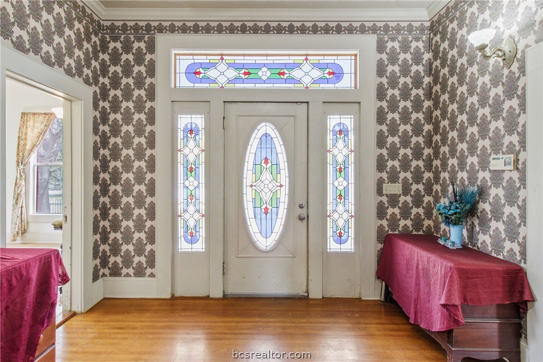 106 South Logan Avenue Bryan, TX 77803 - Photo 6 of 47 a view of entryway with wooden floor