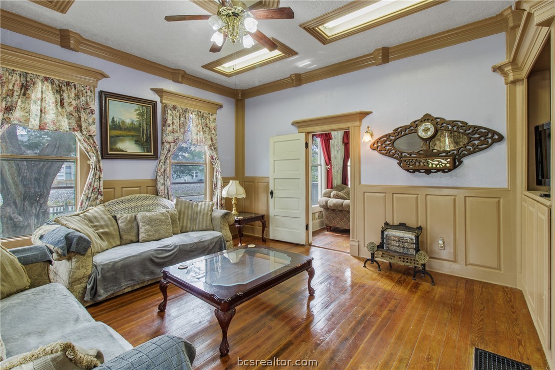 106 South Logan Avenue Bryan, TX 77803 - Photo 10 of 47 a living room with furniture and wooden floor