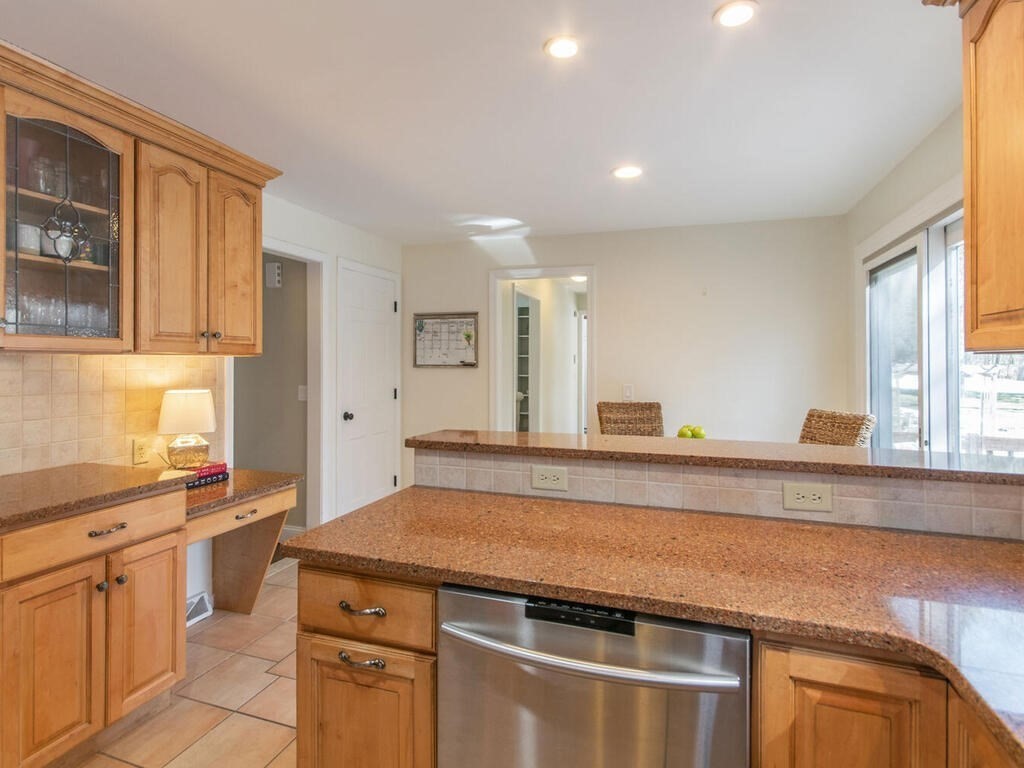 19 Quinnehtuk Road Longmeadow, MA 01106 - Photo 11 of 42 a kitchen with stainless steel appliances granite countertop a sink and cabinets with wooden floor