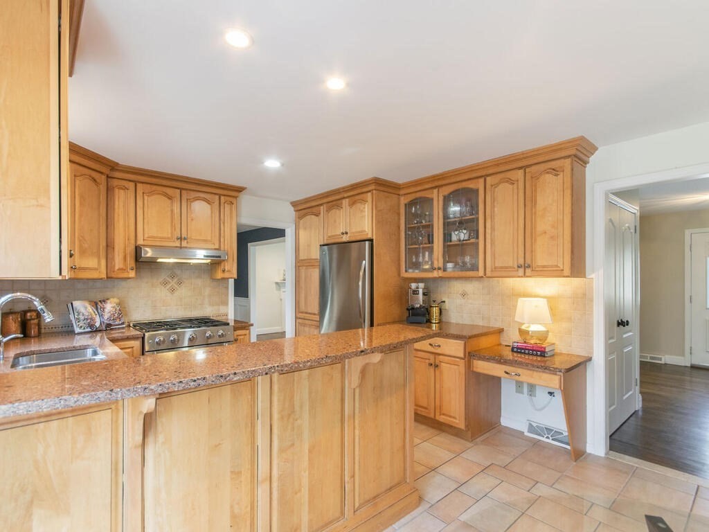 19 Quinnehtuk Road Longmeadow, MA 01106 - Photo 13 of 42 a large kitchen with granite countertop a sink and cabinets
