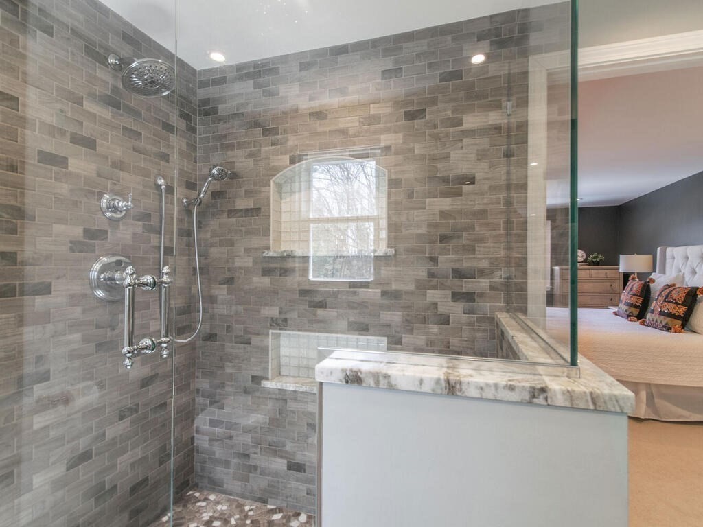 19 Quinnehtuk Road Longmeadow, MA 01106 - Photo 27 of 42 a bathroom with a granite countertop sink a toilet and a shower