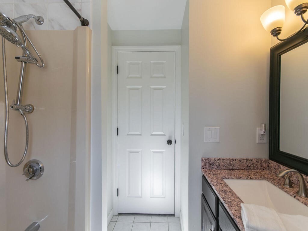 19 Quinnehtuk Road Longmeadow, MA 01106 - Photo 32 of 42 a bathroom with a granite countertop sink a mirror and shower
