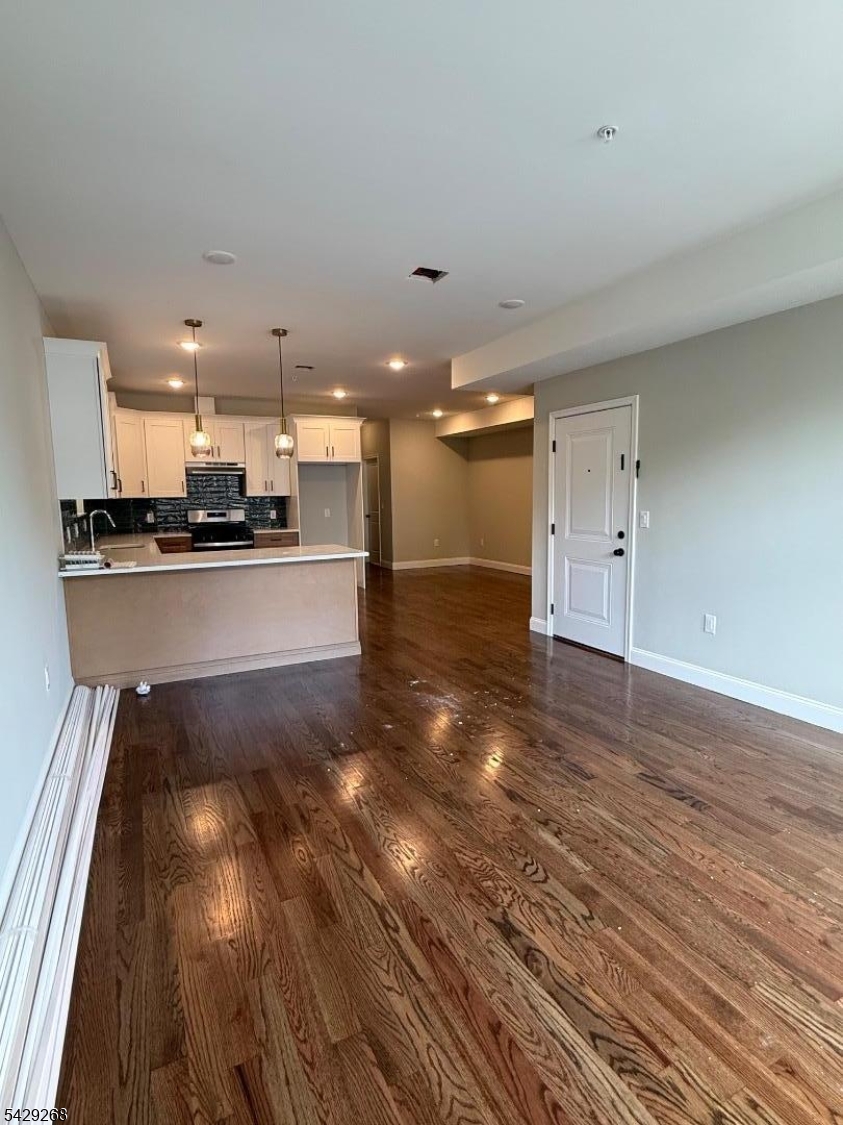223 South 11th Street, Unit 2 Newark, NJ 07107 - Photo 3 of 15 a view of kitchen and kitchen with granite countertop