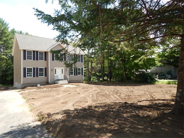 1328 Mammoth Road Pelham, NH 03076 - Photo 1 of 16 a street view covered with snow and trees