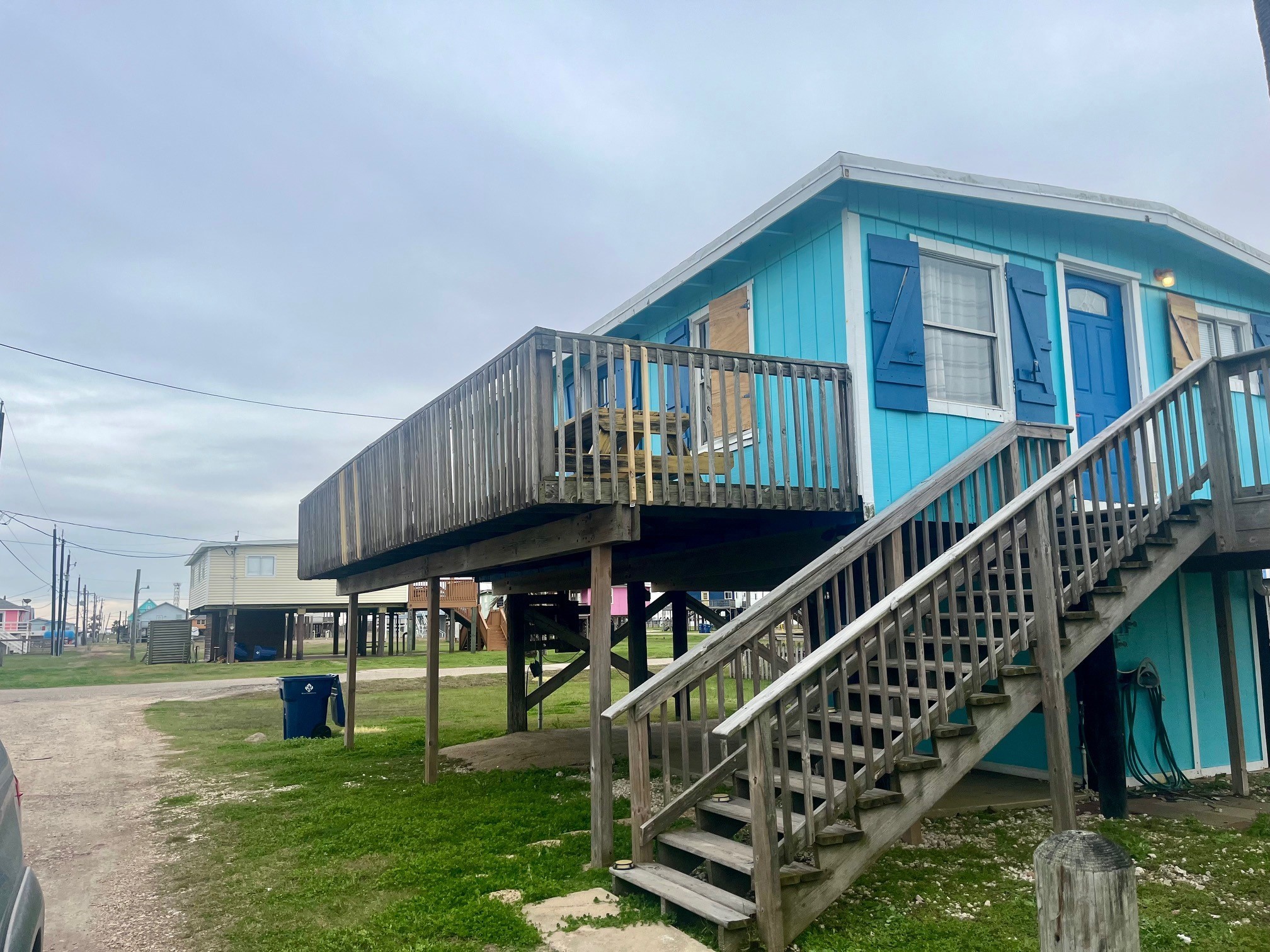 414 Caisson Street Surfside Beach, TX 77541 - Photo 2 of 8 a view of an house with a deck and a yard