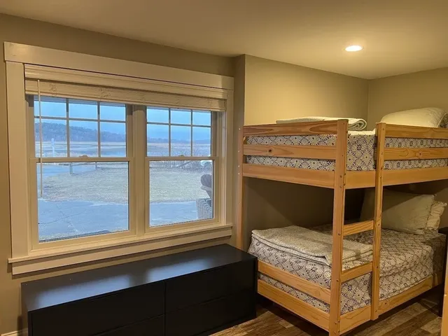 a bed room with a bed and a window
