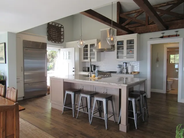 a dining table with chairs and wooden floor