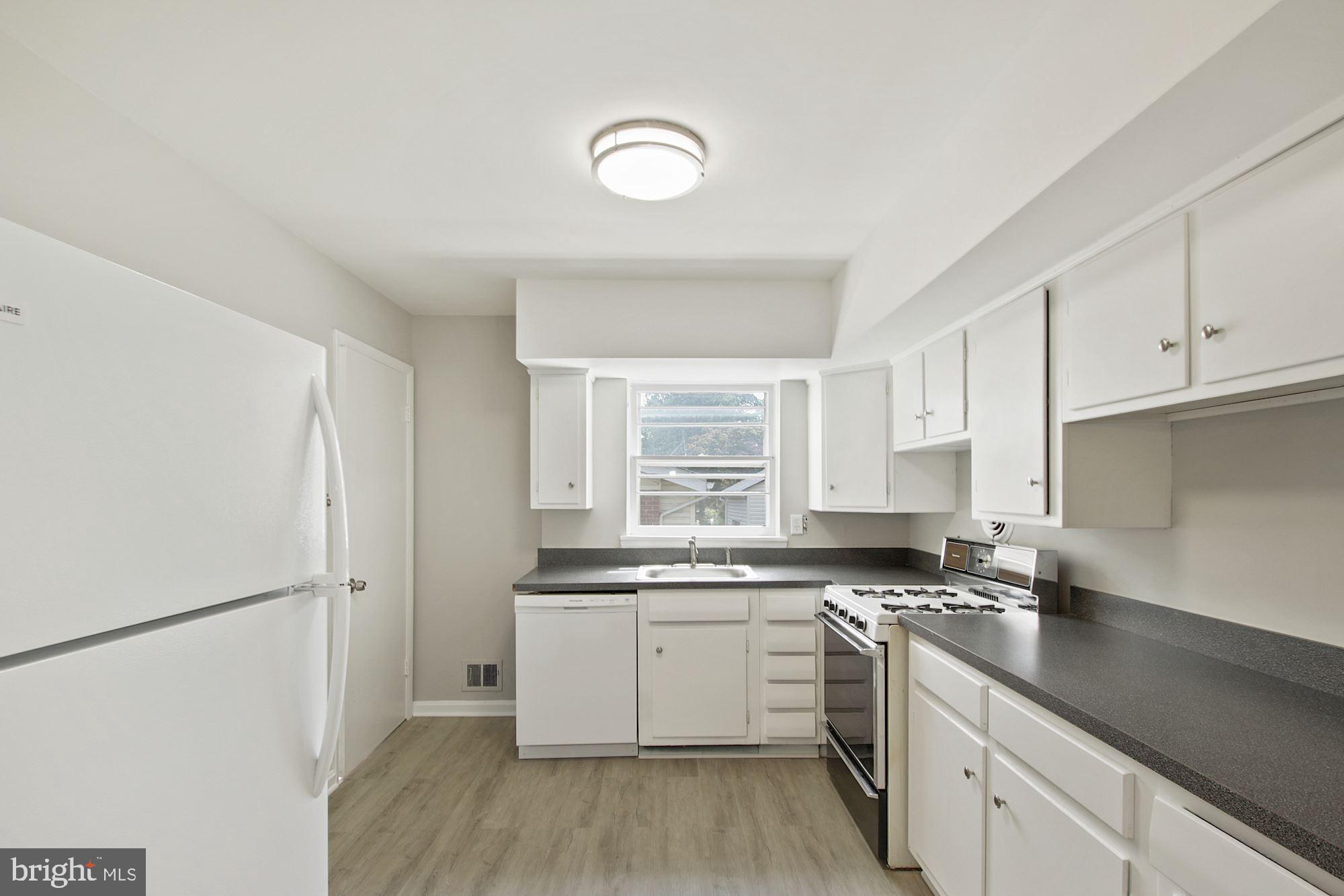 11320 Newport Mill Road Silver Spring, MD 20902 - Photo 5 of 15 Sunny and Bright Kitchen New Dishwasher & Flooring