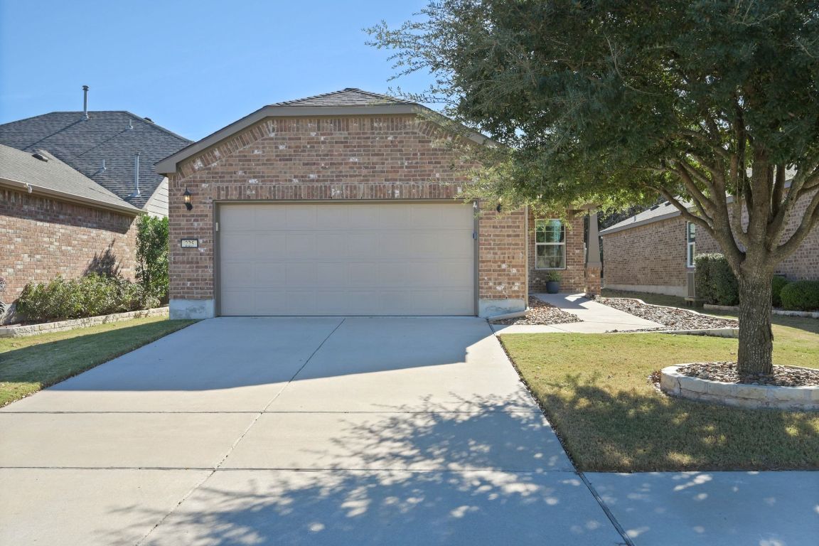 225 Hobby Street Georgetown, TX 78633 - Photo 2 of 40 a front view of a house with a yard