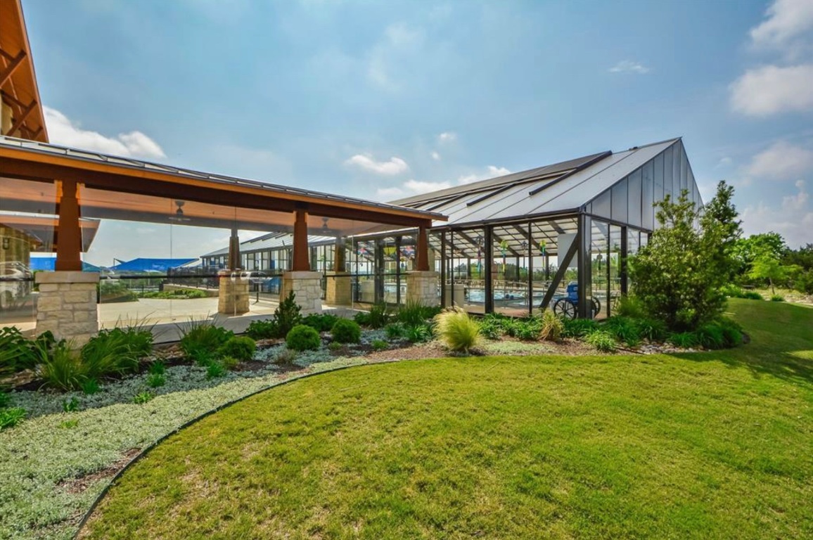 225 Hobby Street Georgetown, TX 78633 - Photo 36 of 40 a view of backyard with a garden and plants
