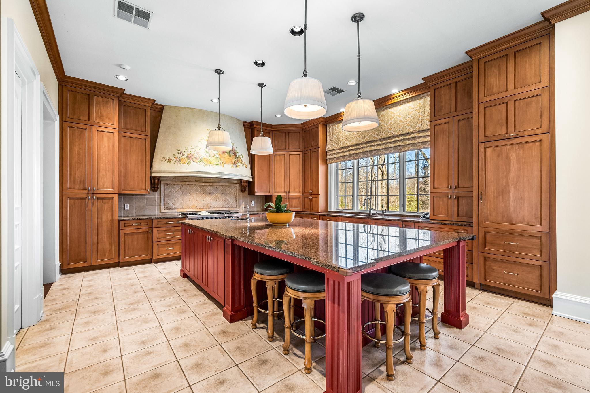 11300 John Carroll Road Owings Mills, MD 21117 - Photo 24 of 102 a kitchen with stainless steel appliances granite countertop a stove a refrigerator and a wooden cabinets