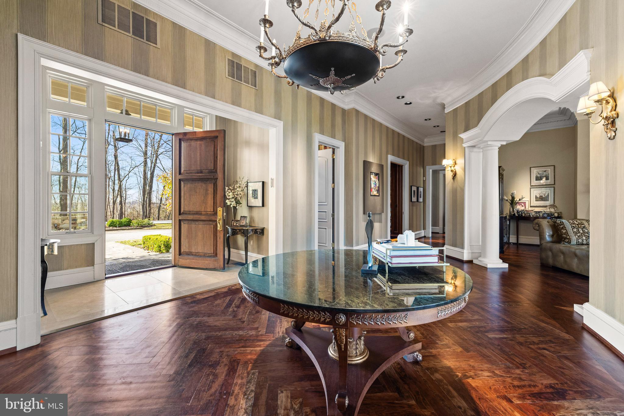 11300 John Carroll Road Owings Mills, MD 21117 - Photo 9 of 102 a view of a dining room with furniture wooden floor and chandelier