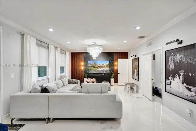 a white bath tub sitting next to a white sink