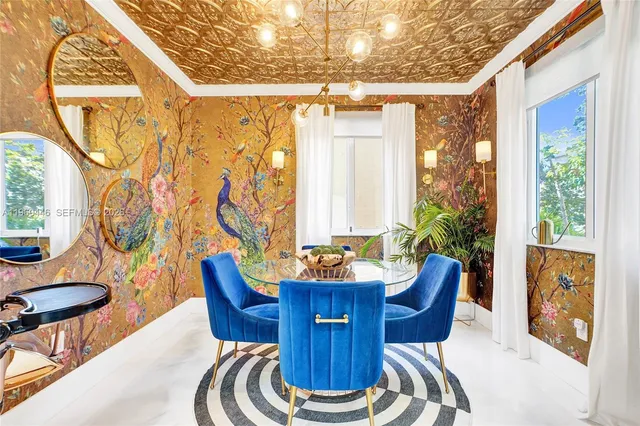 a work room with furniture and a large window