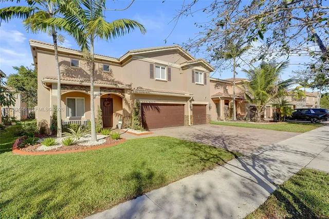 a living room with furniture flat screen tv and a large window