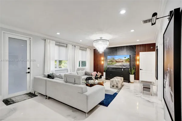 a living room with furniture and a large window