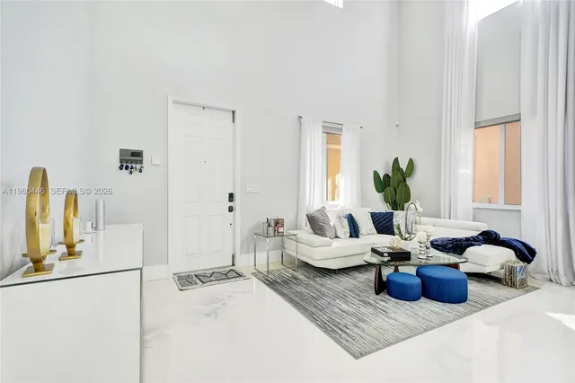 a living room with furniture and a large window