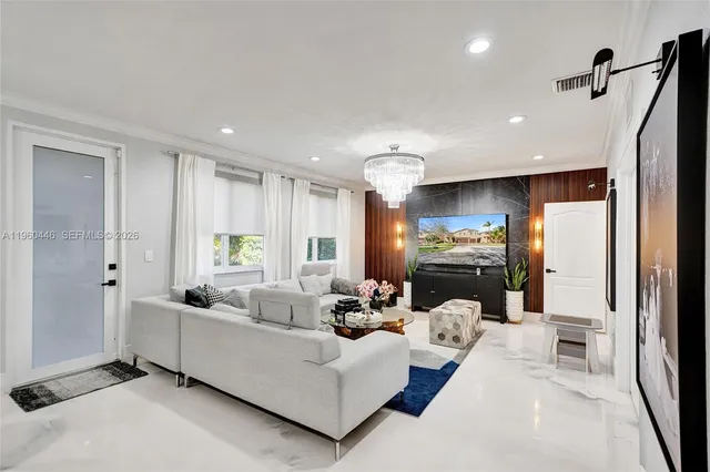 a bedroom with a large bed and wooden floor