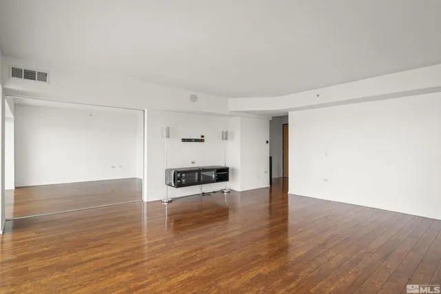 a view of a kitchen with wooden floor