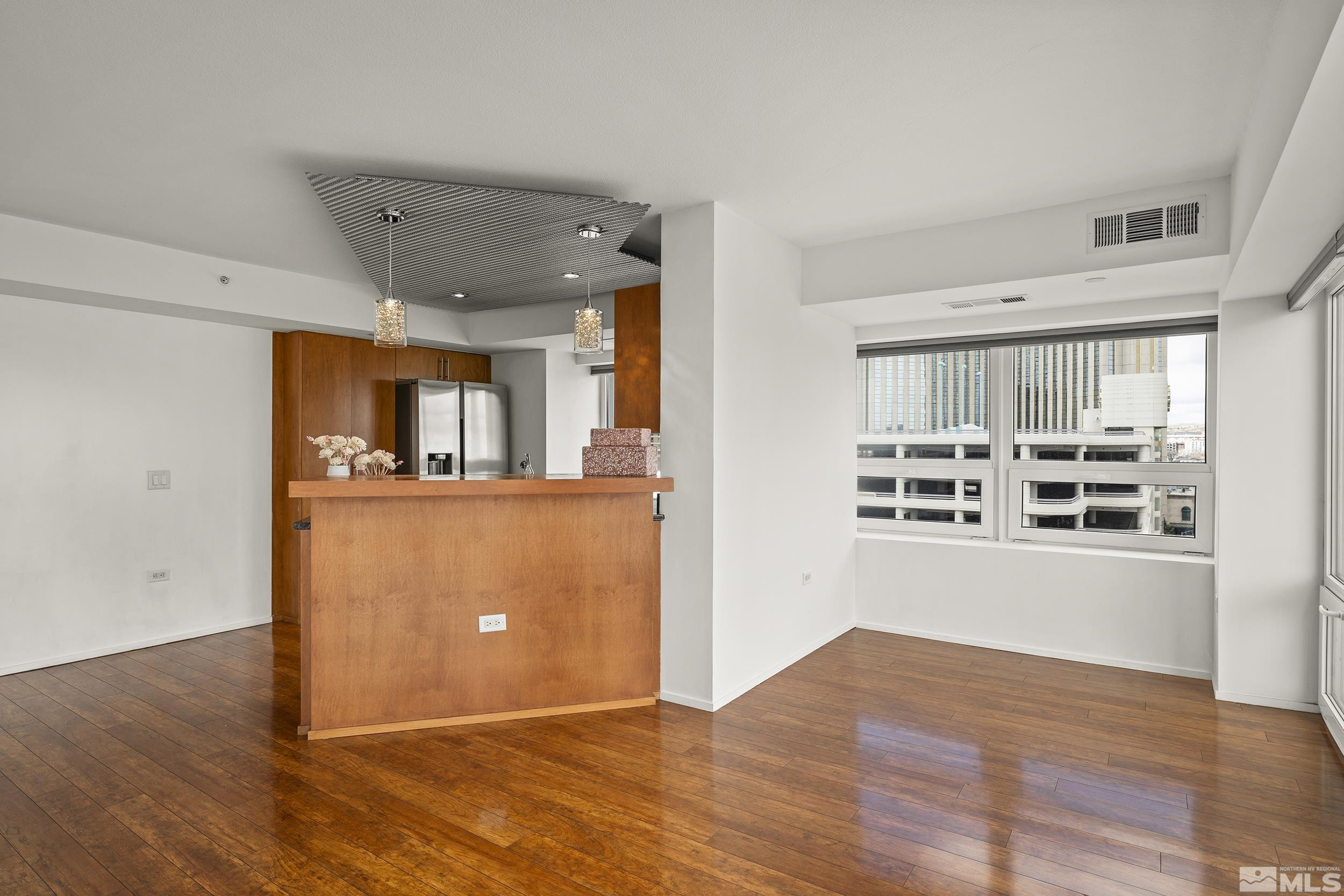 255 North Sierra Street, Unit 1011 Reno, NV 89501 - Photo 17 of 40 a view of a kitchen with wooden floor and a kitchen