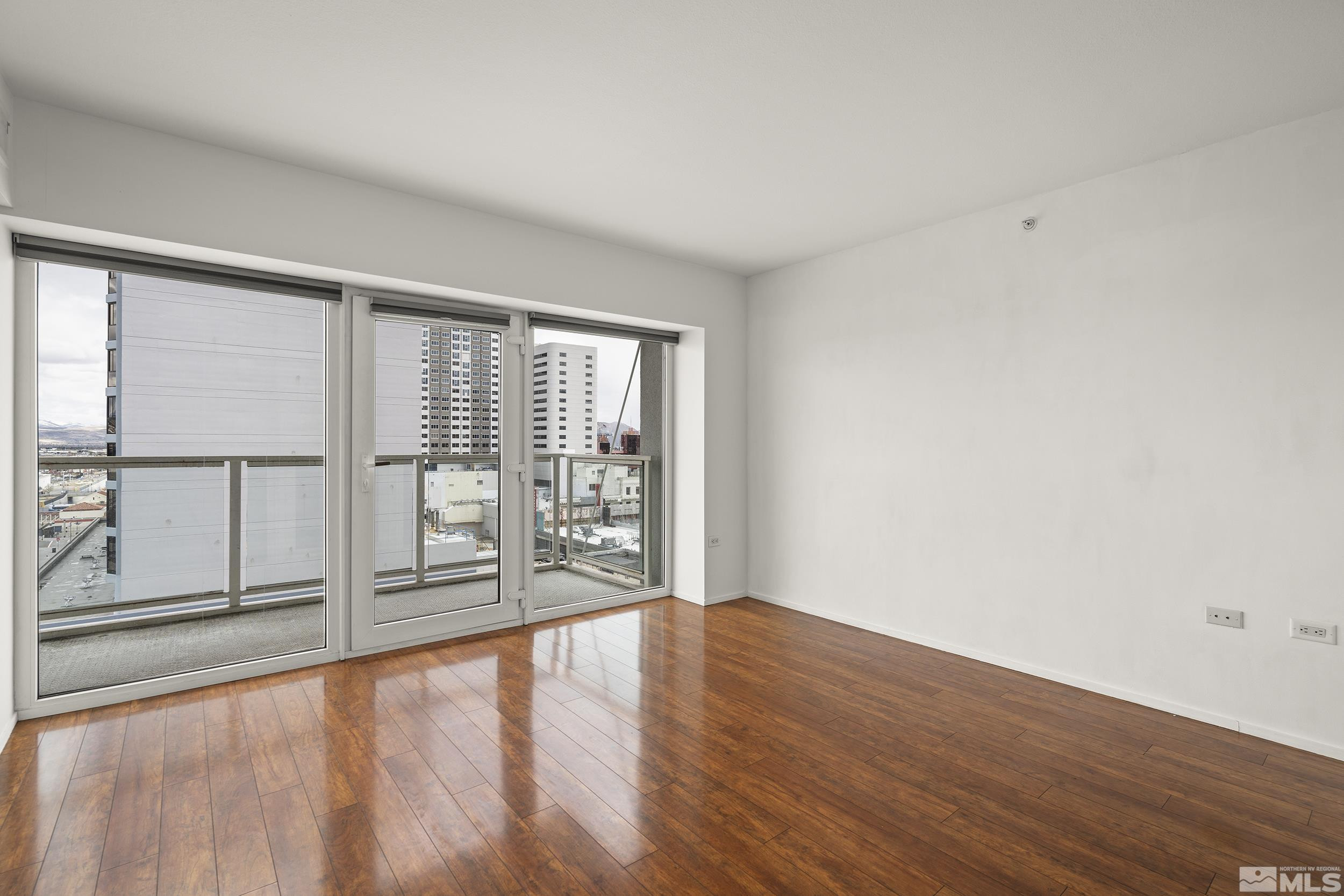 255 North Sierra Street, Unit 1011 Reno, NV 89501 - Photo 18 of 40 wooden floor in an empty room with a window