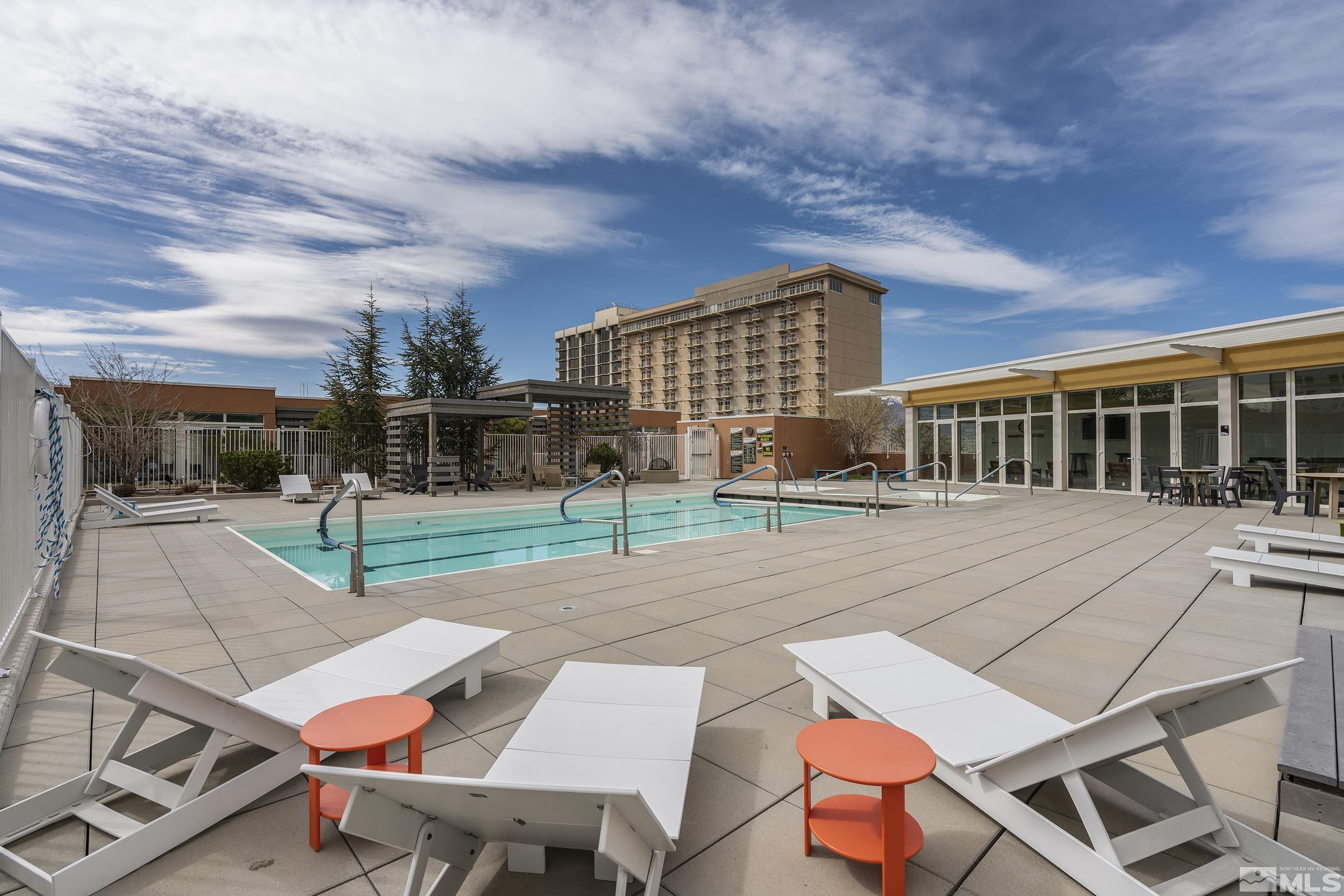 255 North Sierra Street, Unit 1011 Reno, NV 89501 - Photo 31 of 40 a view of a patio with a table and chairs
