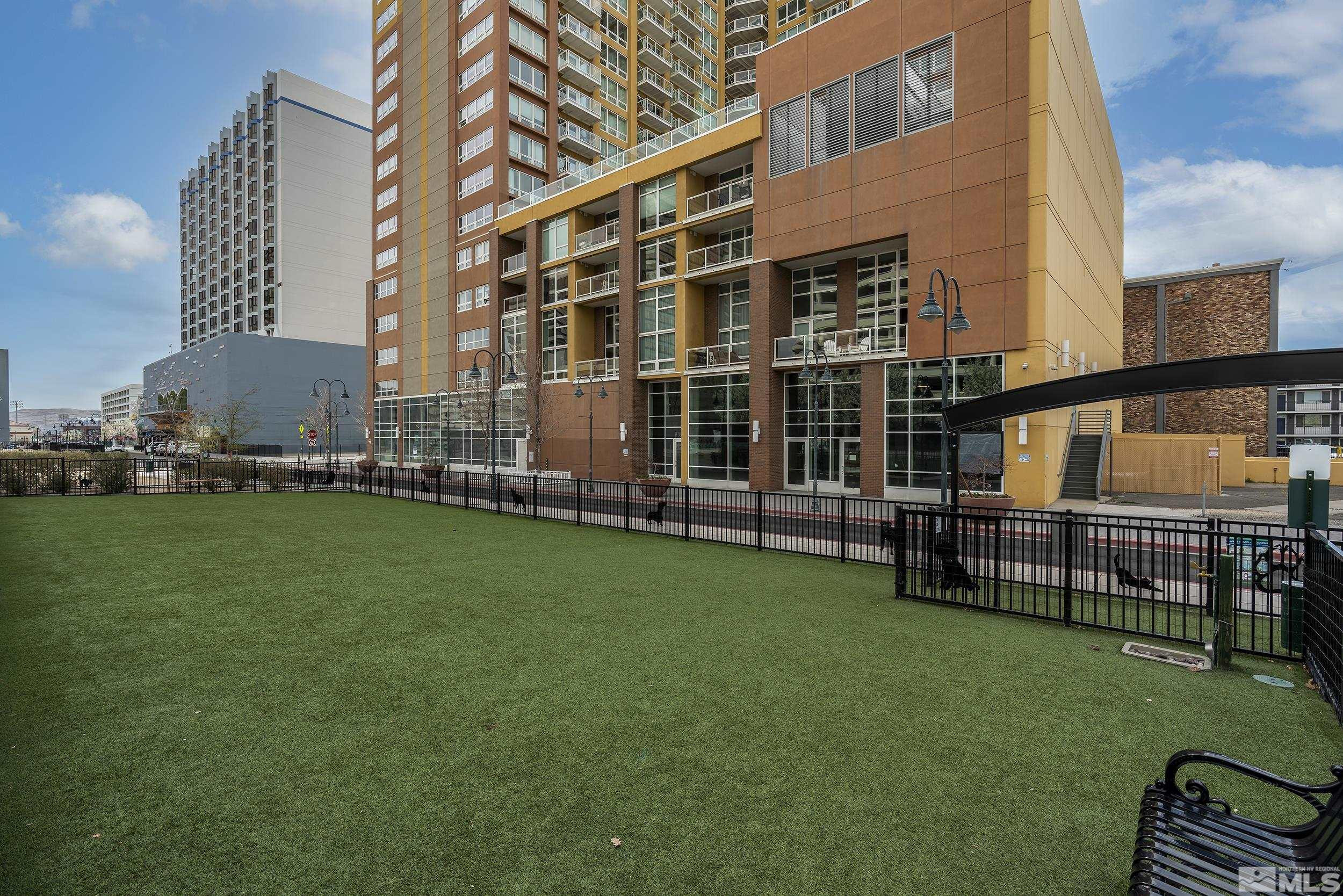 255 North Sierra Street, Unit 1011 Reno, NV 89501 - Photo 36 of 40 a view of a building with a backyard