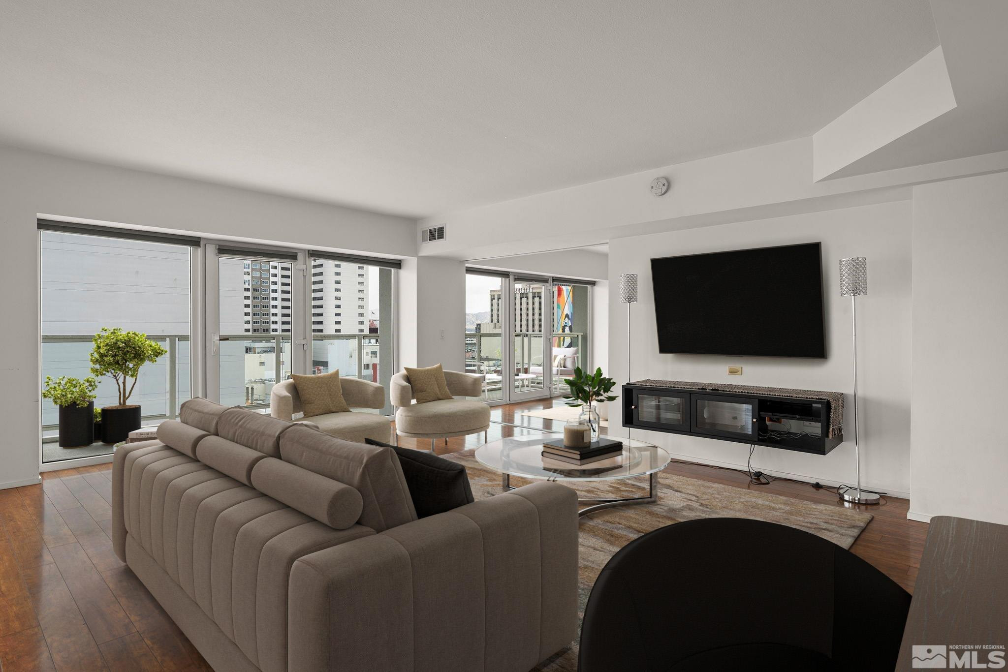 255 North Sierra Street, Unit 1011 Reno, NV 89501 - Photo 5 of 40 a living room with furniture and a flat screen tv