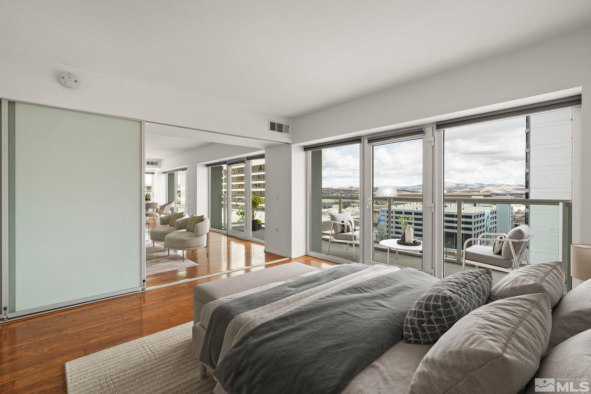 255 North Sierra Street, Unit 1011 Reno, NV 89501 - Photo 9 of 40 a bedroom with a large bed and a large window