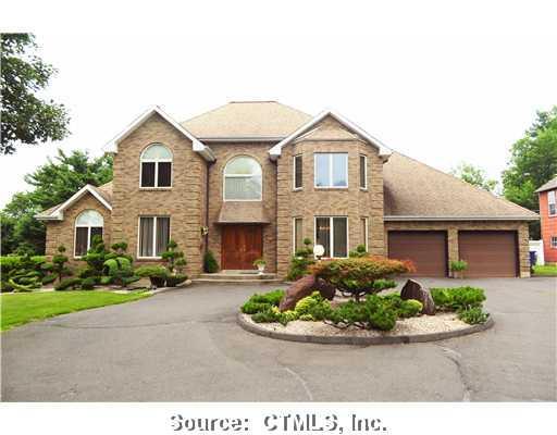 563 Maple Street Wethersfield, CT 06109 - Photo 1 of 1 a front view of a house with a yard