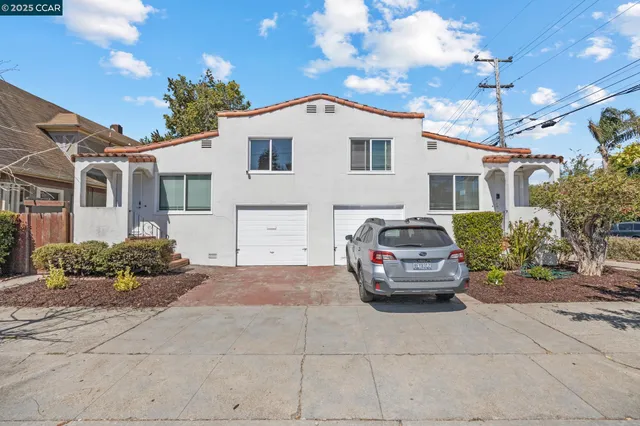 a car parked in front of white house