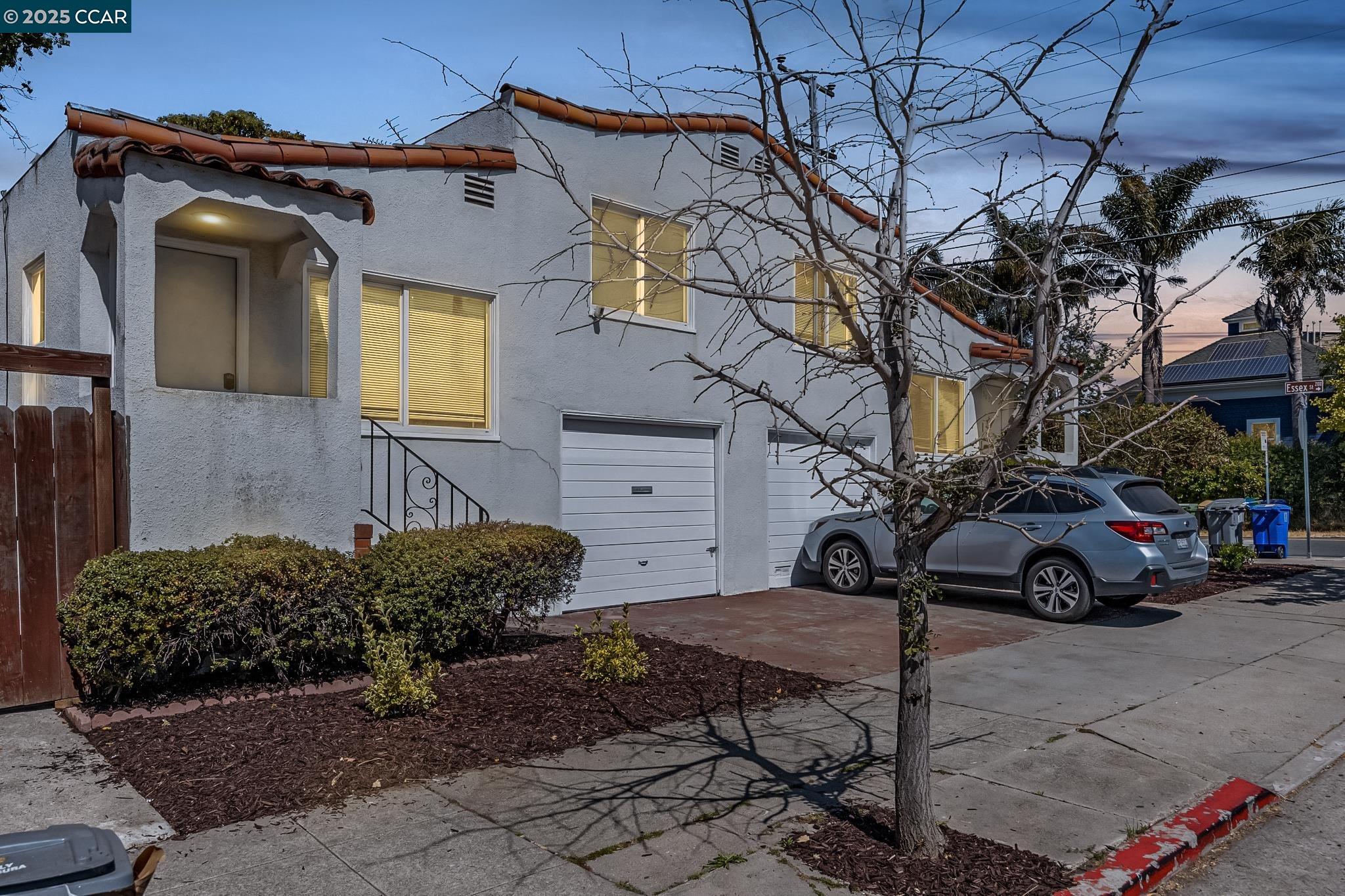 a view of a car parked in front of a house