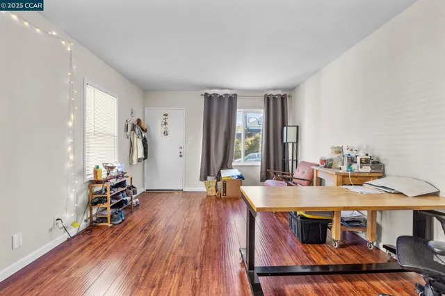 a workspace with furniture and wooden floor