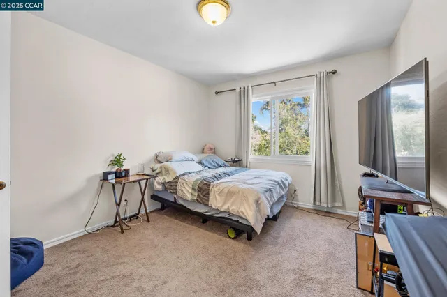a bed room with a bed and a desk