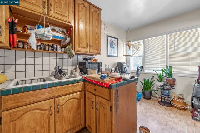 a kitchen with stainless steel appliances granite countertop sink stove and cabinets