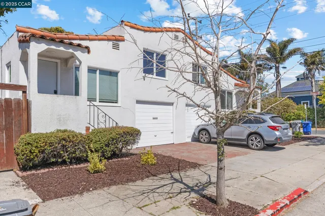 a view of a car park in front of a house