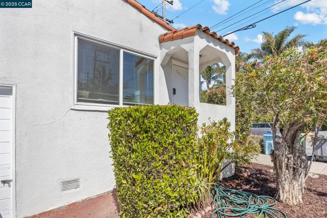 front view of a house with a small yard