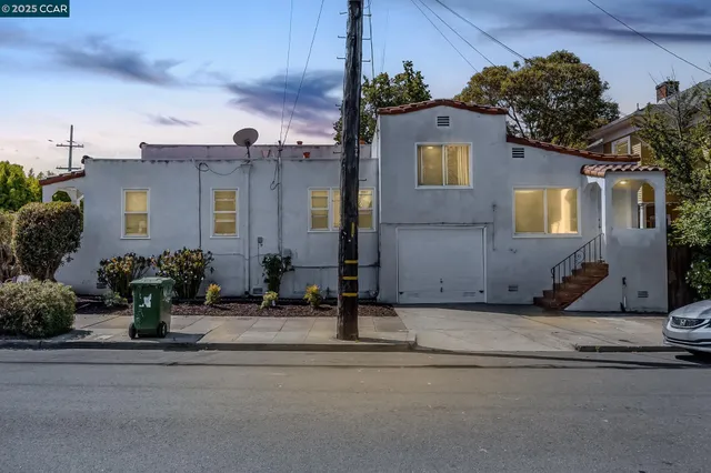a front view of a house with yard