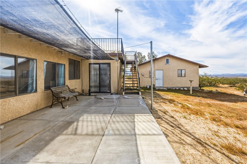 5975 Desert Star Road Johnson Valley, CA 92285 - Photo 25 of 74 a view of a house with a snow in the yard