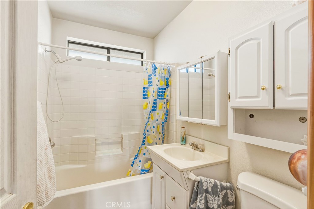 5975 Desert Star Road Johnson Valley, CA 92285 - Photo 33 of 74 a bathroom with a sink a toilet and a bathtub