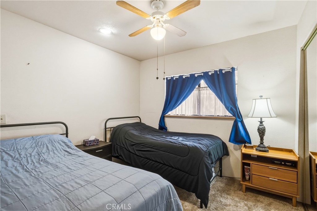 5975 Desert Star Road Johnson Valley, CA 92285 - Photo 34 of 74 a bedroom with a bed and a dresser