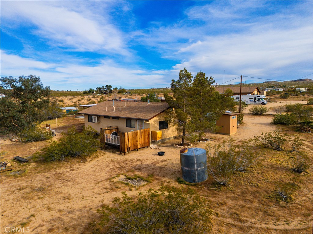 5975 Desert Star Road Johnson Valley, CA 92285 - Photo 36 of 74 a view of a house with a yard