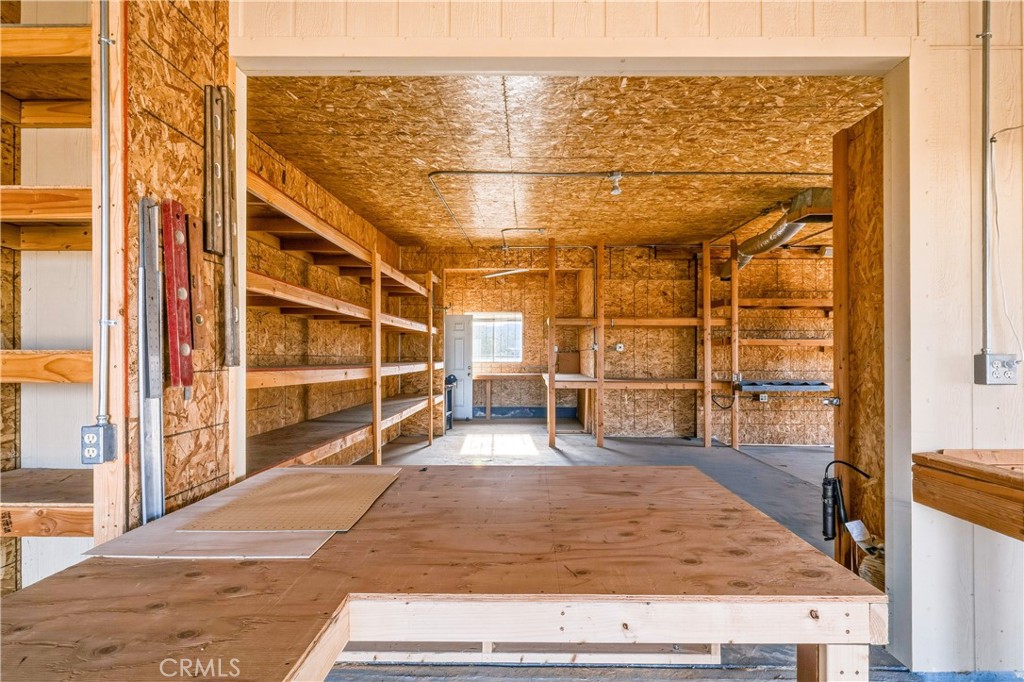 5975 Desert Star Road Johnson Valley, CA 92285 - Photo 47 of 74 a view of an empty room with wooden floor and a window
