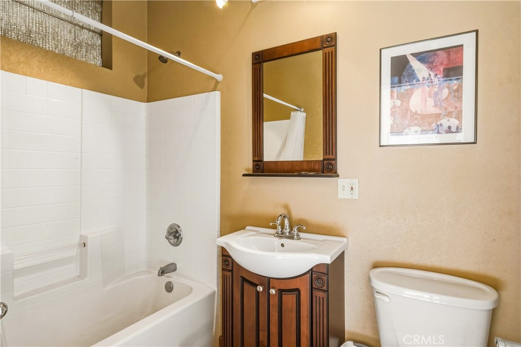 5975 Desert Star Road Johnson Valley, CA 92285 - Photo 56 of 74 a bathroom with a toilet a sink and a bathtub